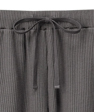 Conjunto superior e inferior de manga corta de tela tipo gofre suave